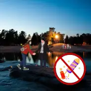 Turn of the year 2026/27 People at the lake in the evening, notice about fireworks ban