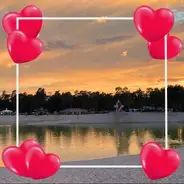 Valentine's Day Sunset over the lake with a lighthouse surrounded by a heart frame