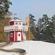 Christmas Südsee-Camp Lighthouse on the beach in the snow